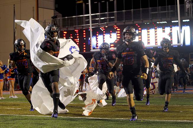 Bishop Gorman High School players take the field for the second half during a game against Chandler (Ariz.) High School at Bishop Gorman Saturday, Aug. 29, 2015. Bishop Gorman beat Chandler 35-14.