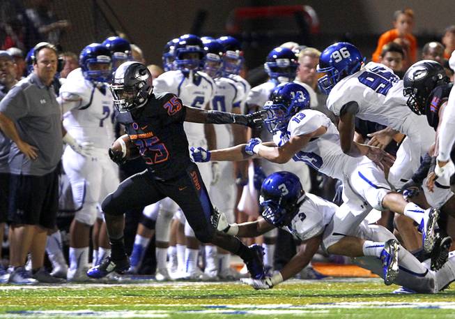 Bishop Gorman High School's Tyjon Lindsey (25) carries the ball on a kickoff return during a game against Chandler (Ariz.) High School at Bishop Gorman Saturday, Aug. 29, 2015. Bishop Gorman beat Chandler 35-14.