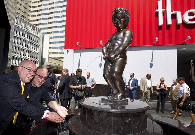 The D Las Vegas headliners Adam London of “Laughternoon” and Kevin Burke of “Defending the Caveman” have fun with Manneken Pis Las Vegas after an unveiling at The D Las Vegas on Tuesday, Sept. 1, 2015, in downtown Las Vegas.