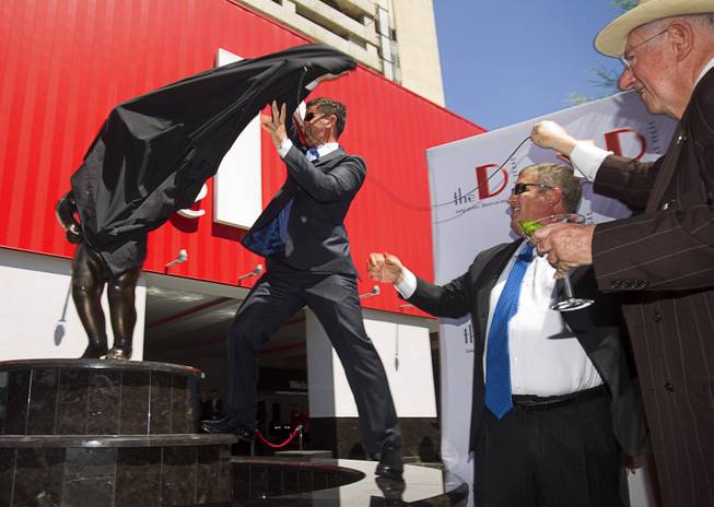 The D Las Vegas owners Greg Stevens and Derek Stevens unveil the Manneken Pis Las Vegas statue during a ceremony at The D Las Vegas on Tuesday, Sept. 1, 2015, in downtown Las Vegas.