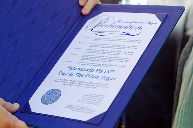 D Las Vegas owner Derek Stevens holds a proclamation from the City of Las Vegas during the unveiling of the Manneken Pis Las Vegas statue at The D Las Vegas on Tuesday, Sept. 1, 2015, in downtown Las Vegas.