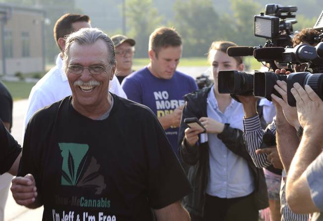 Jeff Mizanskey smiles as he walks away from cameras after being released from Jefferson City Correctional Center on Tuesday, Sept. 1, 2015, in Jefferson City, Mo., after serving two decades of a life sentence for a marijuana-related charge.