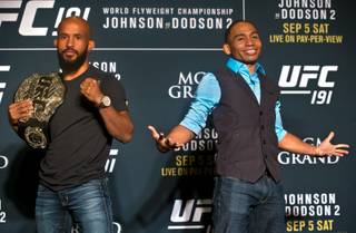 Demetrious Johnson, the UFC flyweight champion, and opponent John Dodson, the No. 1 UFC flyweight contender, strike different poses during UFC 191 media day Thursday, Sept. 3, 2015, at MGM Grand.