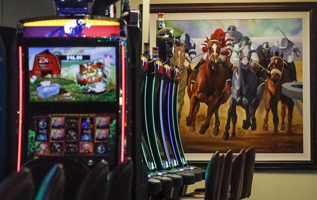 This March 5, 2015, photo shows video gaming terminals at Les Bois Park in Garden City, Idaho. Idaho's highest court says the state must enforce legislation banning lucrative instant horse racing terminals after ruling that Gov. C.L. "Butch" Otter's veto of the bill was invalid.