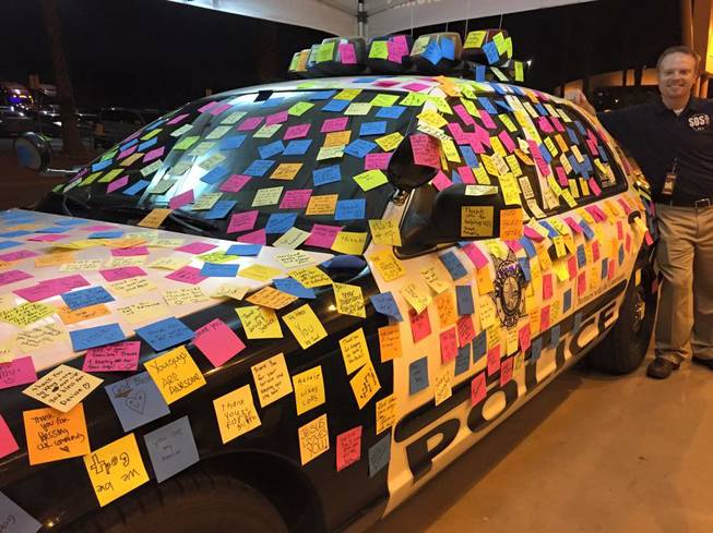 Attendees of a concert at Cashman Field on Saturday, Sept. 19, 2015, left Post-it notes on a Metro police car with words of encouragement for police. The concert featured Christian music acts The Newsboys and Hawk Nelson and was hosted by SOS 90.5-FM.