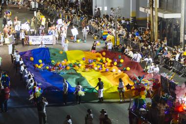 Participants march in the 17th annual PRIDE night parade in downtown Las Vegas, Friday Sept. 18, 2015.