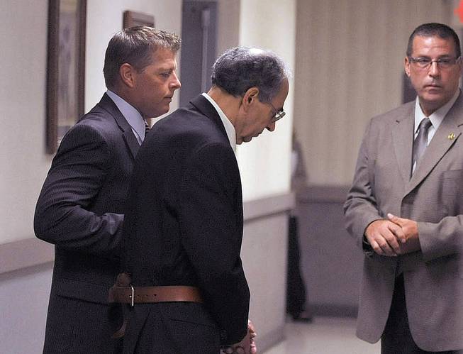 Rev. Joseph Maurizio is led into Federal Court for jury selection in Johnstown, Pa., Wednesday, Sept. 9, 2015, by U.S. Marshals. A key witness in the trial of the U.S. priest charged with traveling to Honduras to molest poor street children during missionary trips has recanted on the stand. 