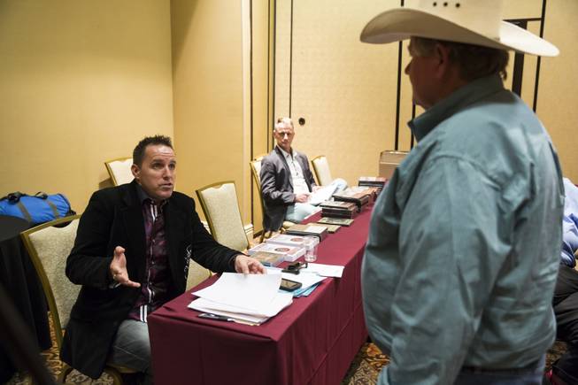 Master hypnotist Richard Barker, at left, gives constructive criticism to Don Warren during a stage hypnosis training seminar at The Orleans, Tuesday Aug. 25, 2015.