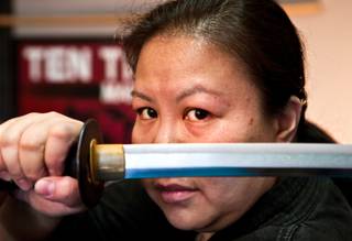 Uyen Vu, pictured here Wednesday, Sept. 23, 2015, is a local bodyguard trained in the use of many weapons and is often hired to keep celebrities, executives and others safe. She trains at Ten Tigers martial-arts studio keeping her skills sharp with hopes of not having to use them.