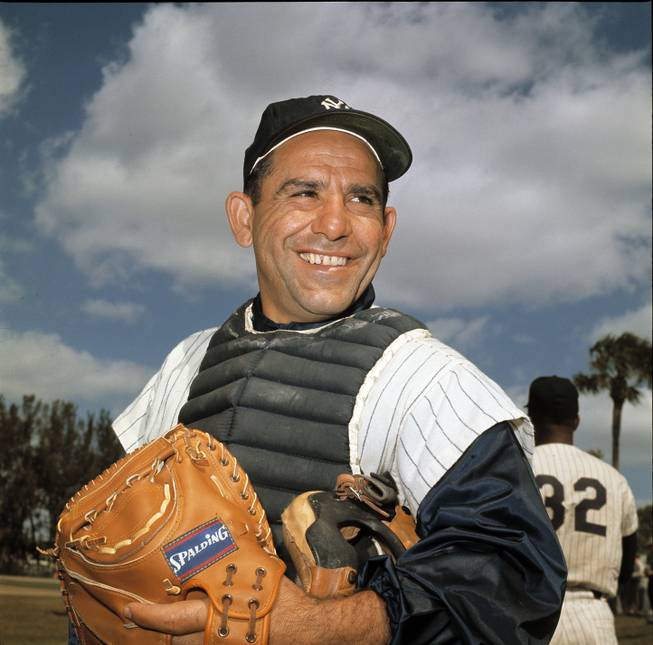 New York Yankee catcher Yogi Berra poses at spring training in Florida, in an undated file photo. Berra, the Yankees Hall of Fame catcher has died. He was 90. 