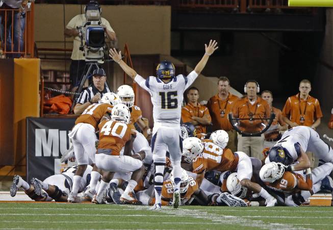 California quarterback Jared Goff celebrates a touchdown during the second half of an NCAA college football game against Texas, Saturday, Sept. 19, 2015, in Austin, Texas. California won 45-44. 