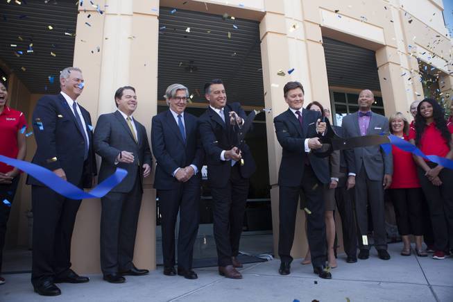 Barrick Gold board member Brian Greenspun, from left, Nevada Sen. Michael Roberson, Chairman of the Board John Thornton, Gov. Brian Sandoval, President Kelvin Dushnisky and Sen. Aaron Ford participate in the ribbon-cutting ceremony for Barrick's global IT operations center in Henderson on Friday. Greenspun is CEO, publisher and editor of Greenspun Media Group.
