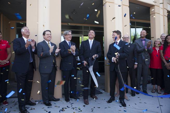 Barrick Gold board member Brian Greenspun, from left, Chief Operating Officer Richard Williams, Chairman of the Board John Thornton, Gov. Brian Sandoval, President Kelvin Dushnisky and Executive Director Michael Brown participate in the ribbon-cutting ceremony for Barrick's global IT operations center in Henderson on Friday, Sept. 25, 2015. Greenspun is CEO, publisher and editor of Greenspun Media Group.