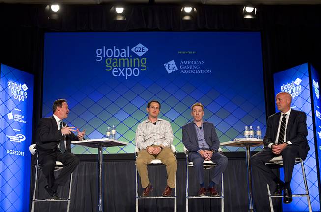Tom Roche, left, of Ernst & Young, moderates a fantasy sports and sports betting panel of , from left, Jason Robins, CEO of DraftKings, Chris Sheffield of Penn National Gaming, and Jeff Burge of CG Technology during the Global Gaming Expo (G2E) Tuesday, Sept. 29, 2015.