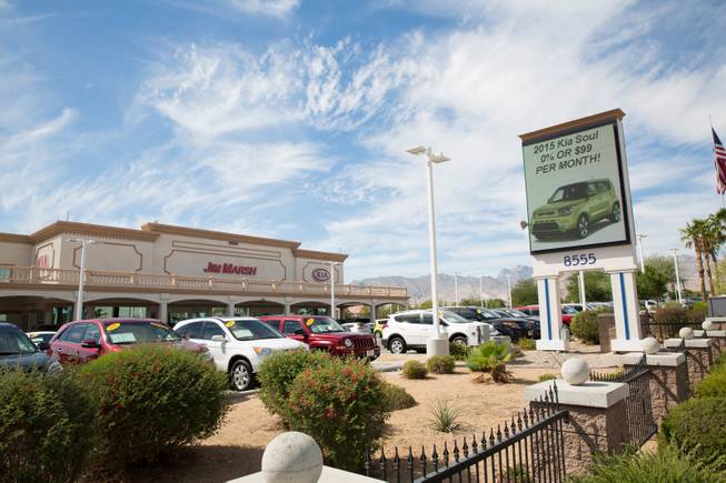 The Jim Marsh Kia Mitsubishi dealership on West Centennial Parkway is shown Tuesday, Sept. 29, 2015. It is among many in the valley that have enjoyed increased sales amid cheap borrowing costs and easier financing.