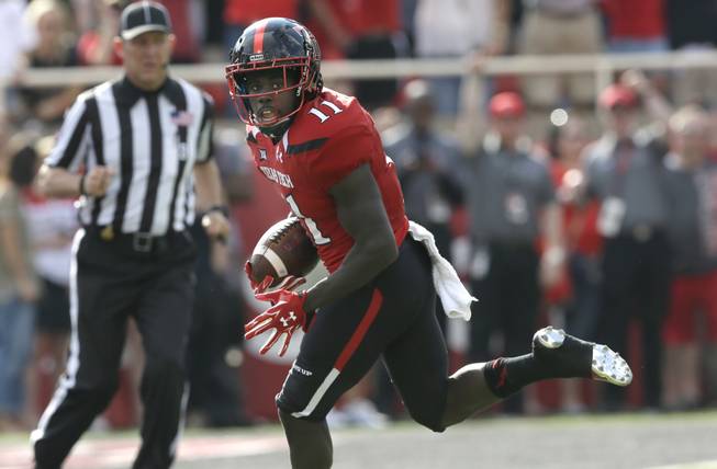 In this Sept. 26, 2015, file photo, Texas Tech wide receiver Jakeem Grant (11) runs in for a touchdown after a reception in the first half of an NCAA college football game against TCU in Lubbock, Texas.
