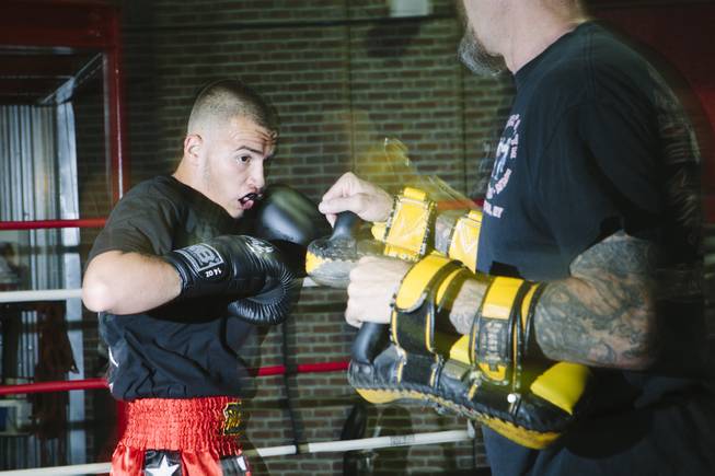 Jonathon "Cisco" Cosio, a muay thai fighter, practices with his coach  at the Sport Center of Las Vegas on September 24, 2015.