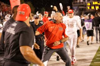 UNLV’s coach Tony Sanchez celebrates his first Fremont Cannon win during the Mountain West game between the UNLV Rebels and the UNR Wolfpack at Mackay Stadium on Saturday, Oct. 3, 2015, in Reno.