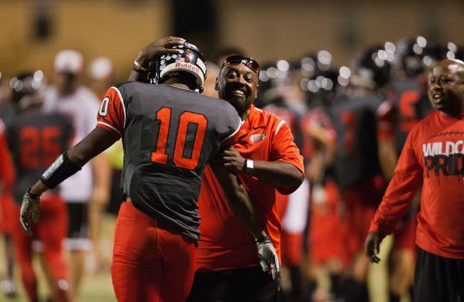 Las Vegas High School's Elijah Hicks, 10, is congratulated on the sidelines for another score as his team dominates Coronado during their football game on Friday, December 02, 2015.