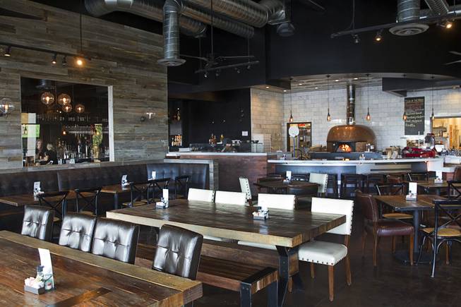 A dining area is shown at the Settebello Pizzeria Napoletana, 9350 W. Sahara Ave., Oct. 4, 2015. Happy Hour is from 3 p.m. to 6 p.m., Monday through Friday and from 8 p.m. to 9 p.m., Monday through Thursday. On Friday, Happy Hour resumes at 8:30 p.m. and runs until 10 pm.