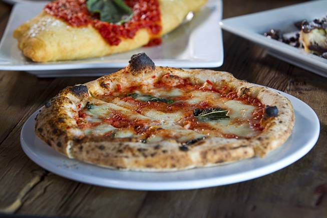 A Margherita pizzette at the Settebello Pizzeria Napoletana, 9350 W. Sahara Ave., Oct. 4, 2015. Happy Hour is from 3 p.m. to 6 p.m., Monday through Friday and from 8 p.m. to 9 p.m., Monday through Thursday. On Friday, Happy Hour resumes at 8:30 p.m. and runs until 10 pm.