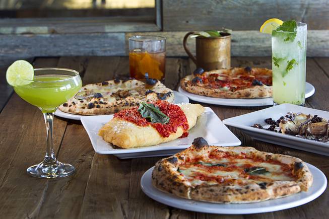 A Fritta, center, is shown among cocktails and pizzettes at the Settebello Pizzeria Napoletana, 9350 W. Sahara Ave., Oct. 4, 2015. At center right is a Crostata Ricotta e Nutella dessert. The drinks from left: Basil Gimlet, Old Fashioned, a Moscow Mule, and a Mint Collins. Happy Hour is from 3 p.m. to 6 p.m., Monday through Friday and from 8 p.m. to 9 p.m., Monday through Thursday. On Friday, Happy Hour resumes at 8:30 p.m. and runs until 10 pm.