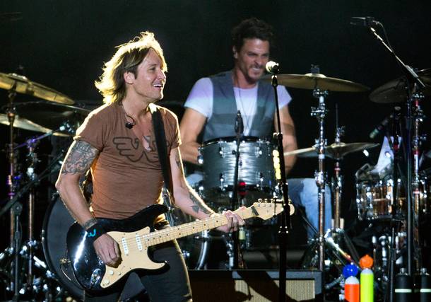 Keith Urban plays for the crowd on the Main Stage during the Route 91 Harvest Country Music Fest on Saturday, Oct. 3, 2015, at Las Vegas Village.