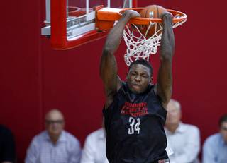 Chris Obekpa (34) throws down a reverse dunk during the Rebels' first basketball practice of the season at the Mendenhall Center on UNLV campus Monday, Oct. 5, 2015.