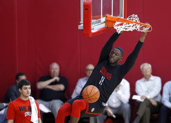 Goodluck Okonoboh (11) dunks during the Rebels' first basketball practice of the season at the Mendenhall Center on UNLV campus Monday, Oct. 5, 2015.