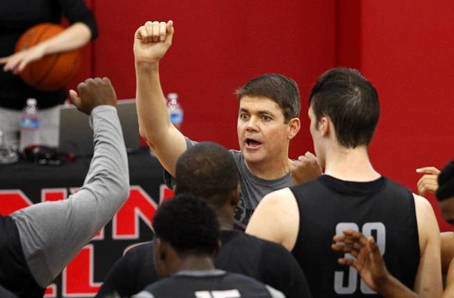 Head Coach Dave Rice, center, talks with players during the Rebels' first basketball practice of the season at the Mendenhall Center on UNLV campus Monday, Oct. 5, 2015.
