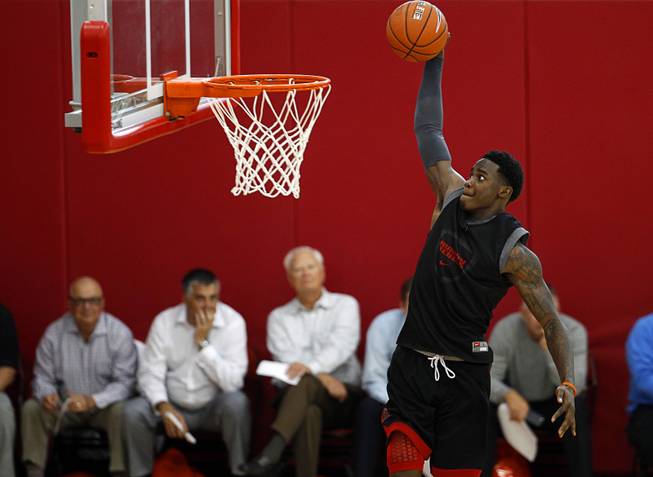 Dwayne Morgan (15) dunks during the Rebels' first basketball practice of the season at the Mendenhall Center on UNLV campus Monday, Oct. 5, 2015.