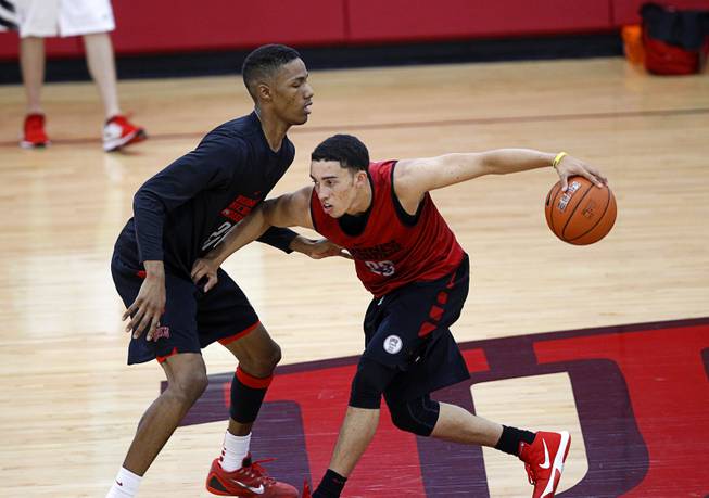 Patrick McCaw, left, (22) covers teammate Austin Starr (20) during the Rebels' first basketball practice of the season at the Mendenhall Center on UNLV campus Monday, Oct. 5, 2015.