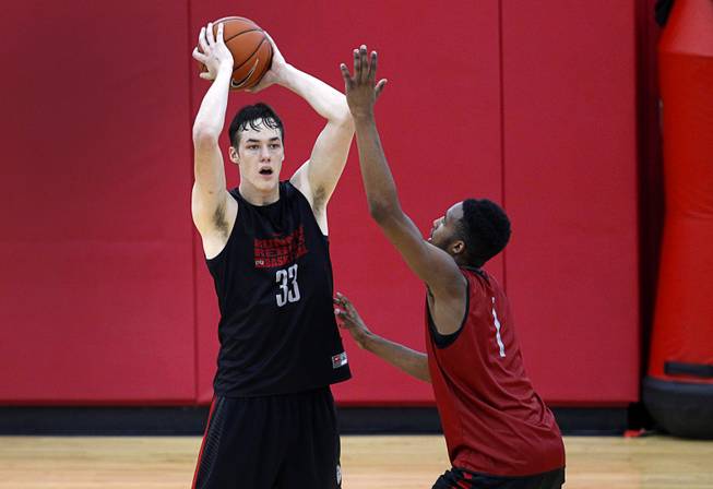 Stephen Zimmerman Jr. (33) is guarded by Derrick Jones Jr. (1) during the Rebels' first basketball practice of the season at the Mendenhall Center on UNLV campus Monday, Oct. 5, 2015.