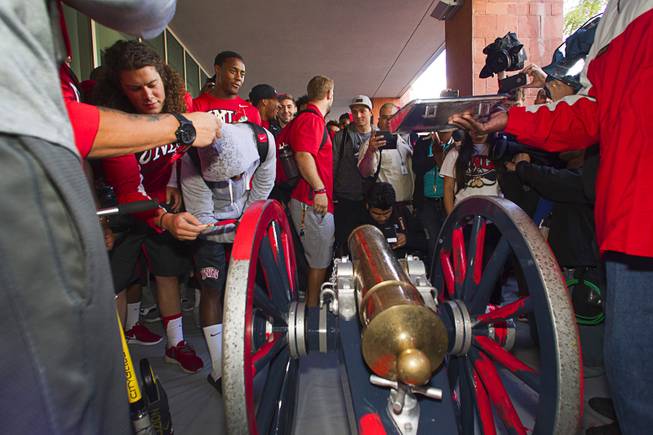 UNLV football players paint the Fremont Cannon red during a ceremony Monday, Oct. 5, 2015, at UNLV. The Rebels recovered the Fremont Cannon after defeating the Wolfpack 23-17 on Saturday in Reno.