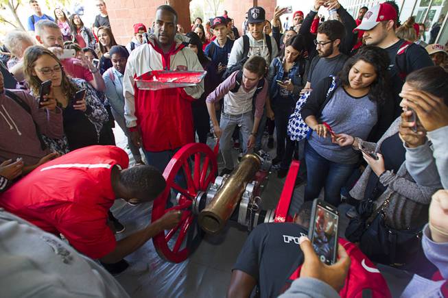 UNLV students and alumni paint the Fremont Cannon red during a ceremony Monday, Oct. 5, 2015, at UNLV. The Rebels recovered the Fremont Cannon after defeating the Wolfpack 23-17 on Saturday in Reno.