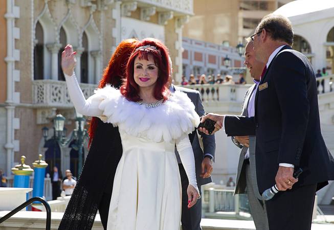 Naomi Judd waves as she arrives at an outdoor stage Tuesday, Oct. 6, 2015, at the Venetian. Reuniting for the first time in nearly five years, the mother-daughter duo The Judds will perform at the Venetian Theater from Oct. 7-24, 2015.