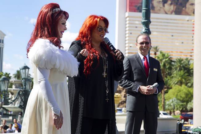 Naomi and Wynonna Judd — The Judds — arrive Tuesday, Oct. 6, 2015, at the Venetian as Pete Boyd, right, senior vice president of operations at the Venetian, watches. Reuniting for the first time in nearly five years, the mother-daughter duo will perform at the Venetian Theater from Oct. 7-24, 2015.
