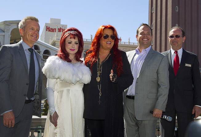 Naomi and Wynonna Judd — The Judds — stand with John Nelson, senior vice president of AEG Live, Bobby Reynolds, vice president of booking for AEG Live, and Pete Boyd, senior vice president of operations at the Venetian, on Tuesday, Oct. 6, 2015, at the Venetian. Reuniting for the first time in nearly five years, the mother-daughter duo will perform at the Venetian Theater from Oct. 7-24.