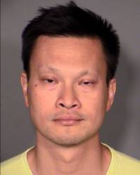 This Clark County Detention Center booking photo of June 20, 2015, shows Dr. Binh Minh “Ben” Chung, 41.
