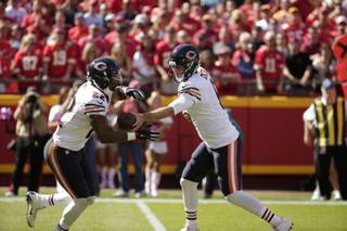 Chicago Bears quarterback Jay Cutler (6) hands the ball off to running back Matt Forte (22) during the first half of an NFL football game against the Kansas City Chiefs in Kansas City, Mo., Sunday, Oct. 11, 2015. (AP Photo/Charlie Riedel)