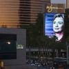 An image of Democratic presidential candidate Hillary Rodham Clinton is shown on the marquee sign Monday, Oct. 12, 2015, at Wynn Las Vegas. The Democratic presidential candidates' first debate is at the Wynn on Tuesday and will be televised on CNN.