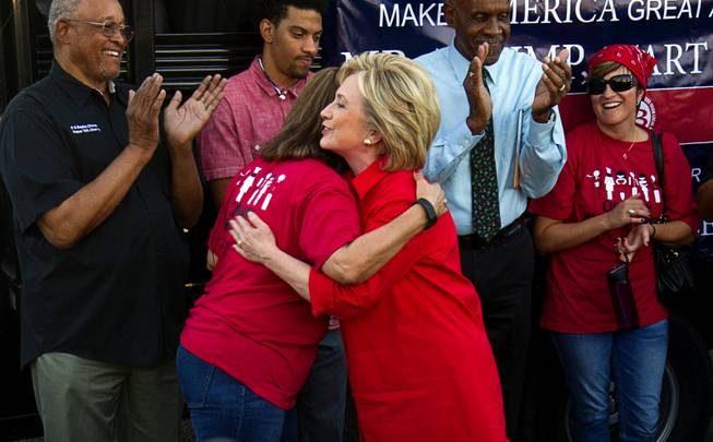 Democratic presidential candidate and former Secretary of State Hillary Clinton, right, gives a hug to Geoconda Arguello Kline, secretary-treasurer for Culinary Workers Union, Local 226, after speaking at a Culinary demonstration by the Trump International Hotel Monday, Oct. 12, 2015.