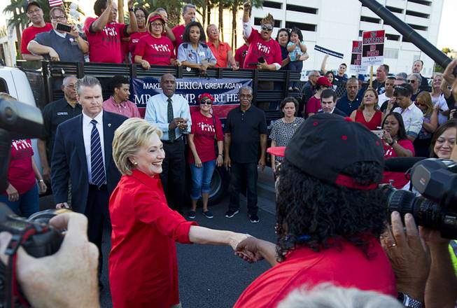 Democratic presidential candidate and former Secretary of State Hillary Clinton greets union members during a Culinary Workers Union, Local 226, demonstration by the Trump International Hotel Monday, Oct. 12, 2015.