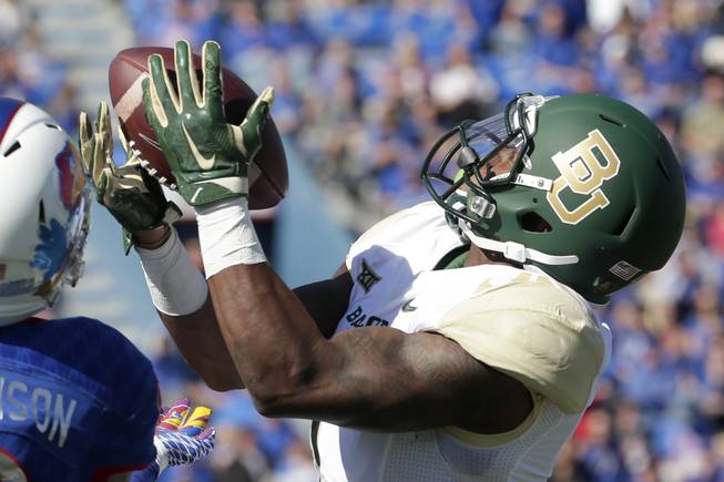 Baylor wide receiver Corey Coleman (1) catches a pass during the first half of an NCAA college football game against Kansas Saturday, Oct. 10, 2015, in Lawrence, Kan. Baylor won 66-7.