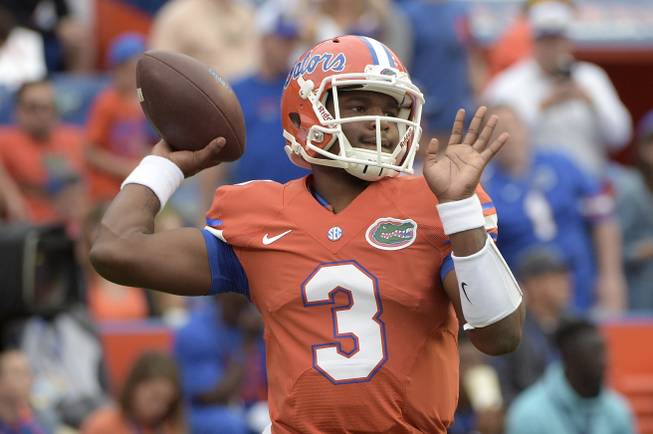 Florida quarterback Treon Harris (3) warms up before an NCAA college football game against Mississippi Saturday, Oct. 3, 2015, in Gainesville, Fla. 