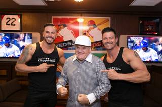 Mikey Perez and Nathan Minor of Chippendales at the Rio flank Pete Rose at the Pete Rose Bar and Grill grand opening Tuesday, Oct. 13, 2015, at Hawaiian Marketplace on the Strip.
