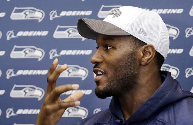 In this Jan. 16, 2014, file photo, Seattle Seahawks' Derrick Coleman speaks with members of the media about how he can read lips, before an NFL football practice in Renton, Wash. Seattle Seahawks fullback Derrick Coleman has been arrested and is under investigation of vehicular assault and felony hit-and-run. 