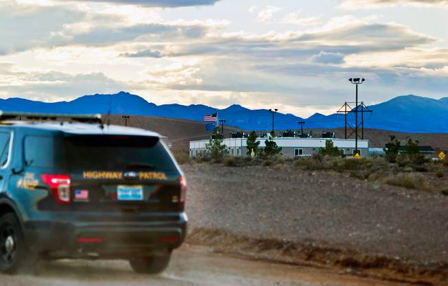 A Nevada Highway Patrol vehicle drives up to the US Ecology site outside of Beatty, Nevada, the day after a fire at a nearby closed nuclear waste dump  on Tuesday, Oct. 20, 2015.