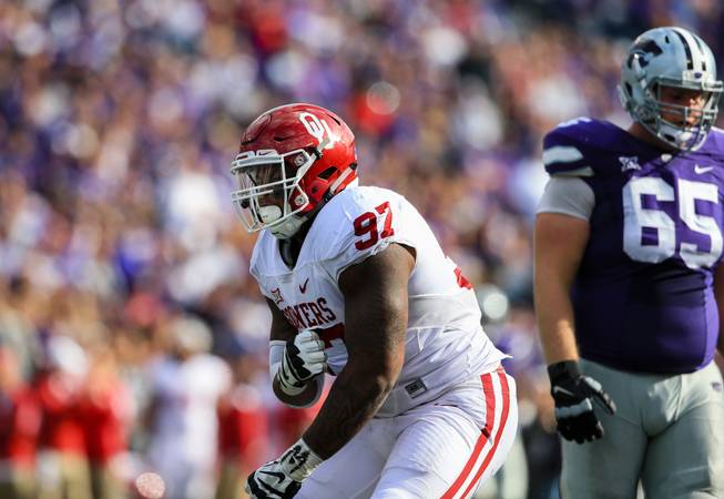 Oklahoma defensive tackle Charles Walker (97) celebrates a tackle during the first half of an NCAA college football game against Kansas State in Manhattan, Kan., Saturday, Oct. 17, 2015.