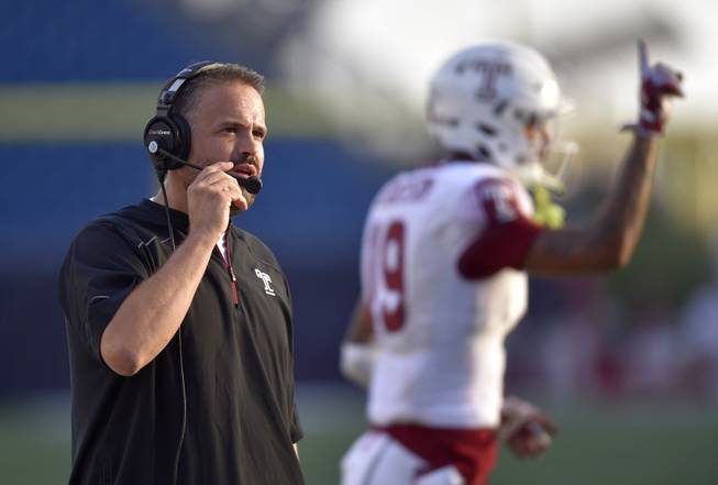 Temple Head Coach Matt Rhule coaches from the sideline during the second half of an NCAA college football game against Massachusetts at Gillette Stadium in Foxborough, Mass., Saturday, Sept. 19, 2015.